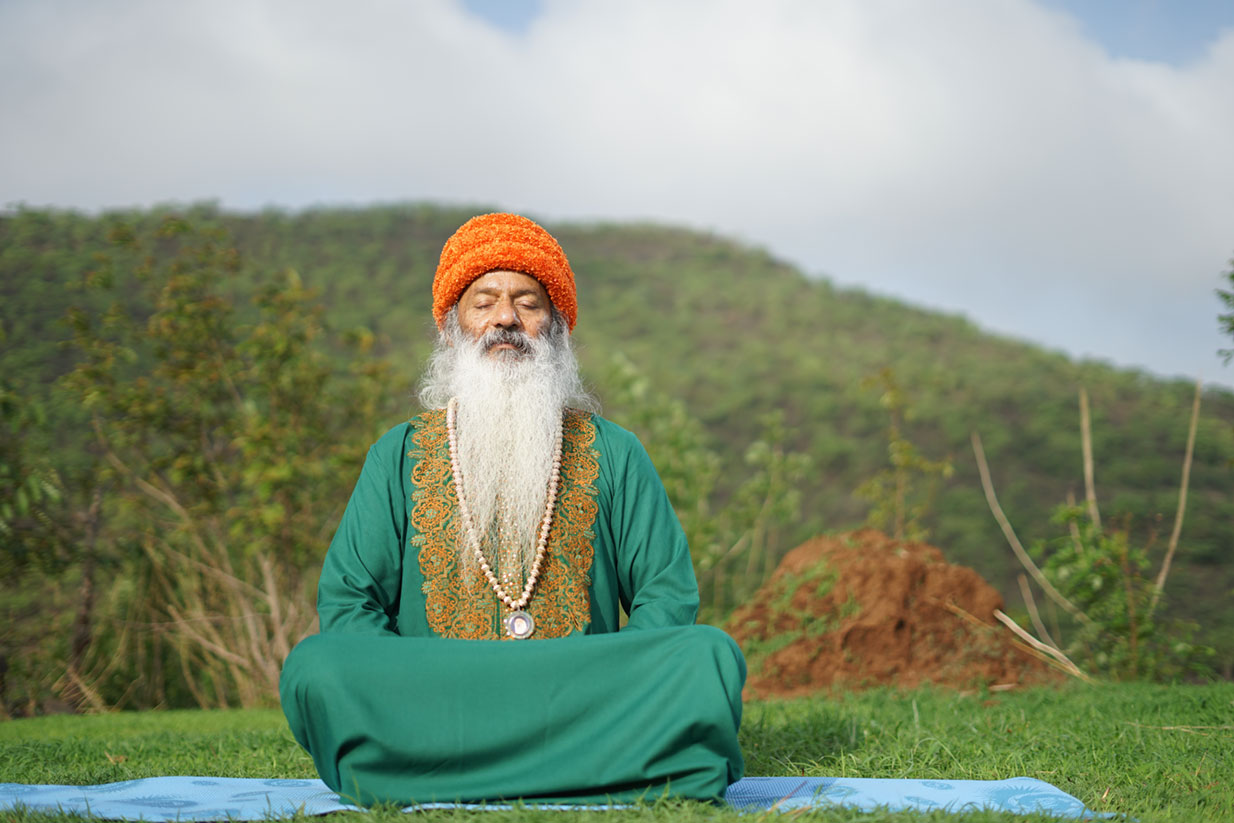 Swami Shailendra Saraswati meditating outdoors